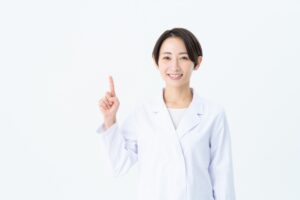 人差し指を立てる医師