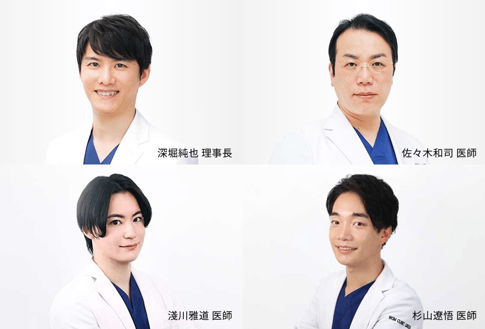白衣を着た男性医師4人